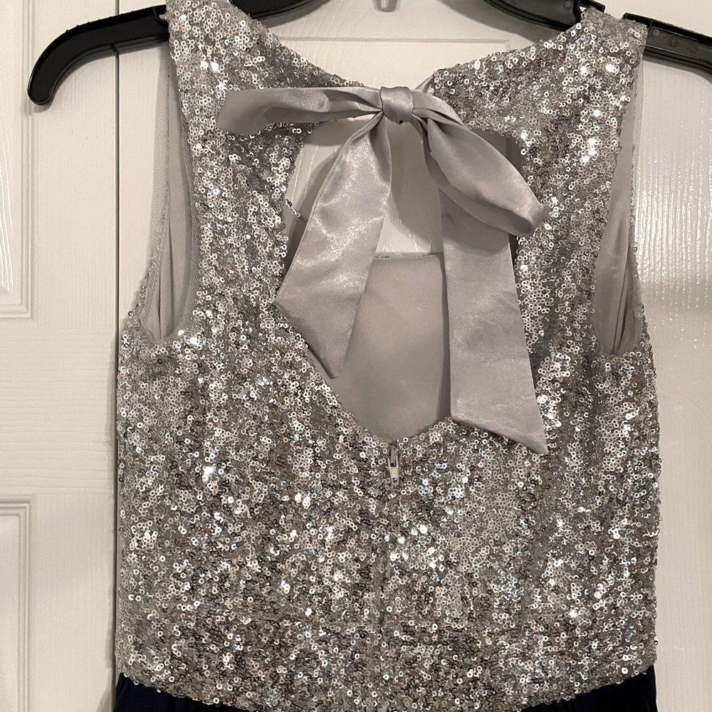 Silver sequin and navy blue high-low dress.
